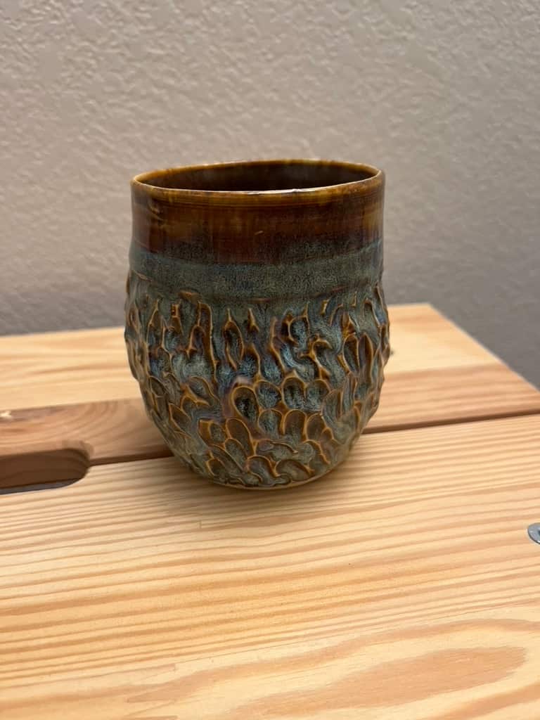 A carved mug.