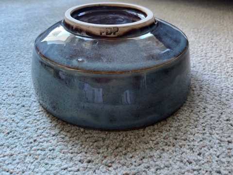 A bowl shown upside down.