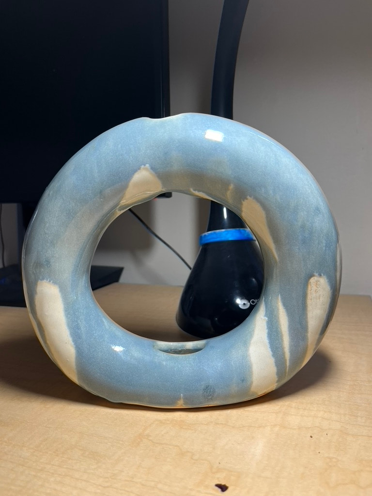 A drippy donut vase.