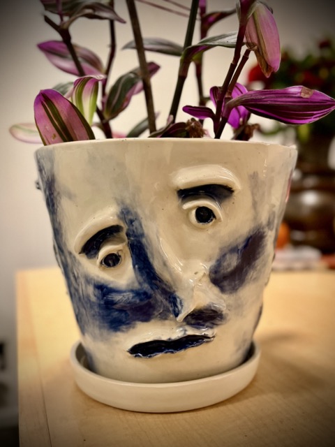 A pot with a face.