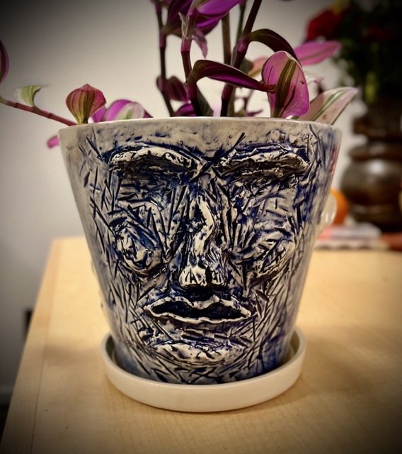 A pot with a face.
