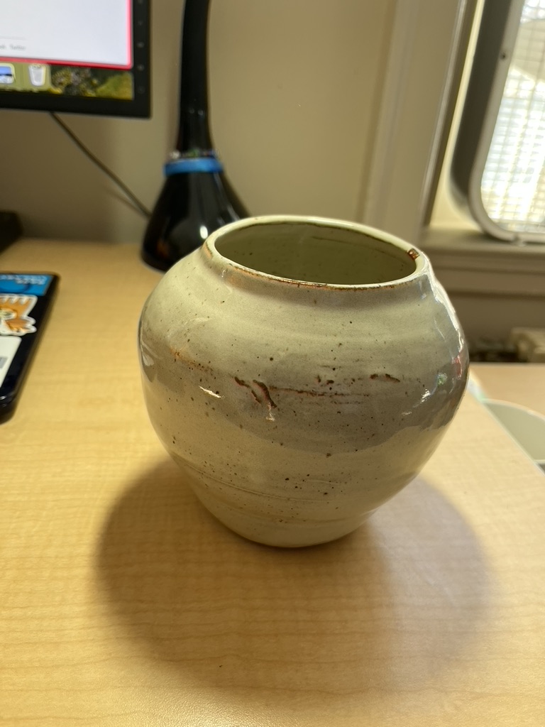 A small white vase.