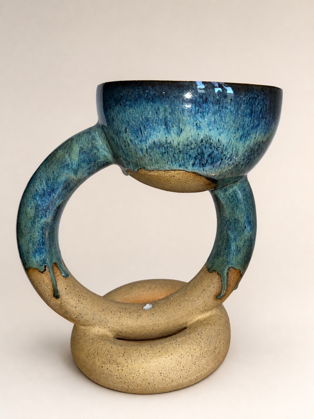 A donut-shaped ceramic planter.