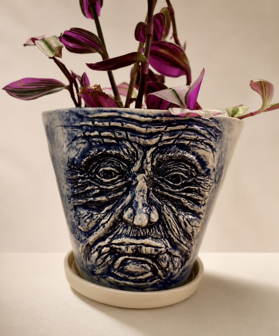 A ceramic face planter.
