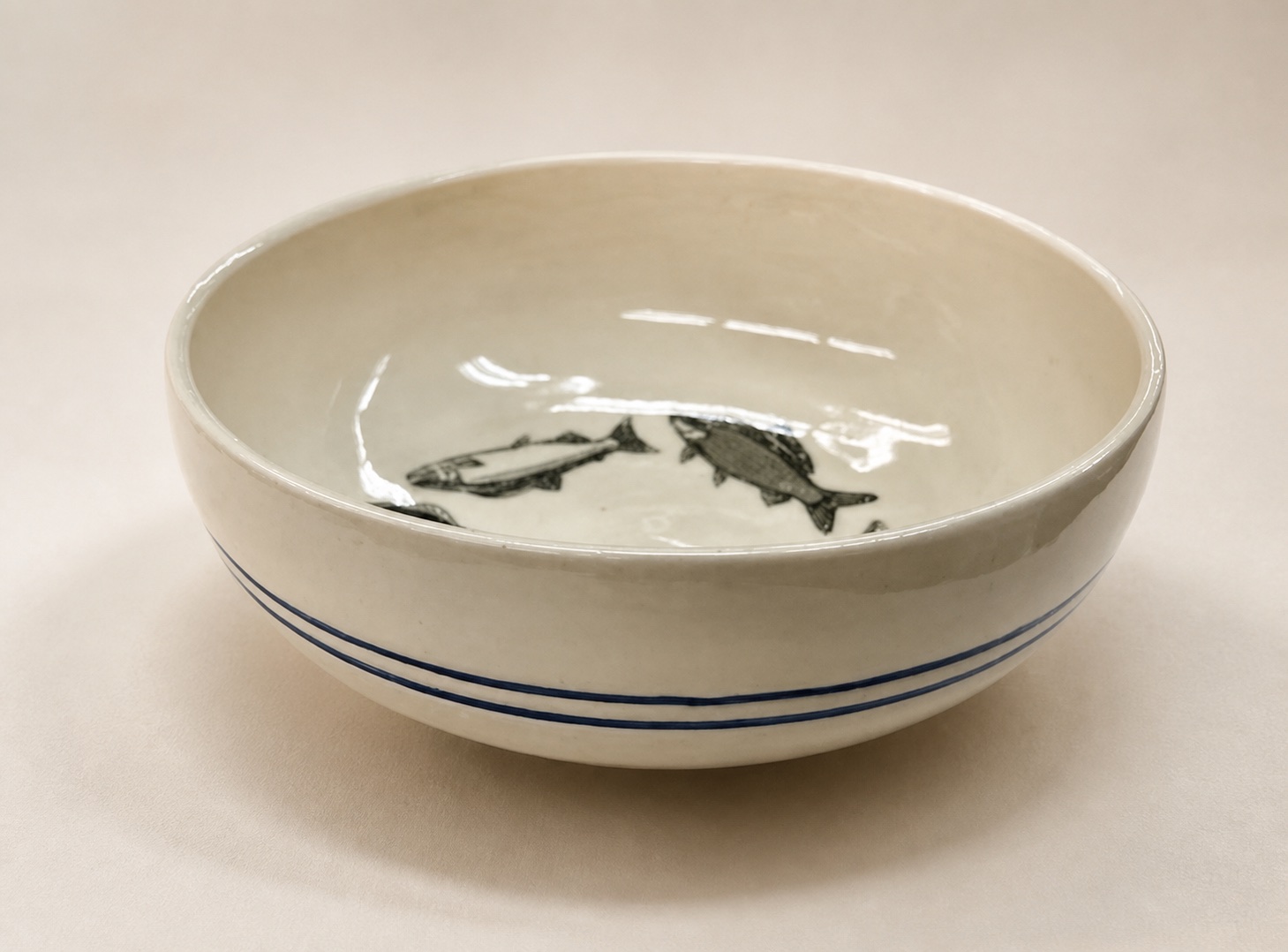 A ceramic bowl decorated with fish.