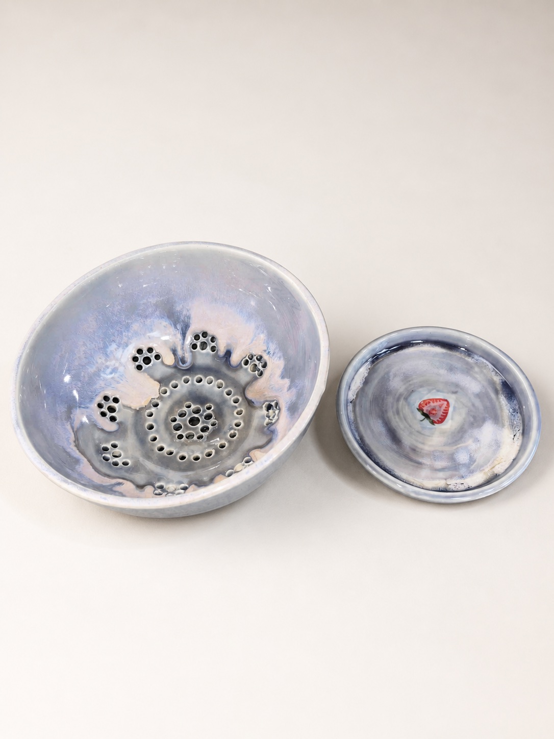 A purple ceramic berry bowl.