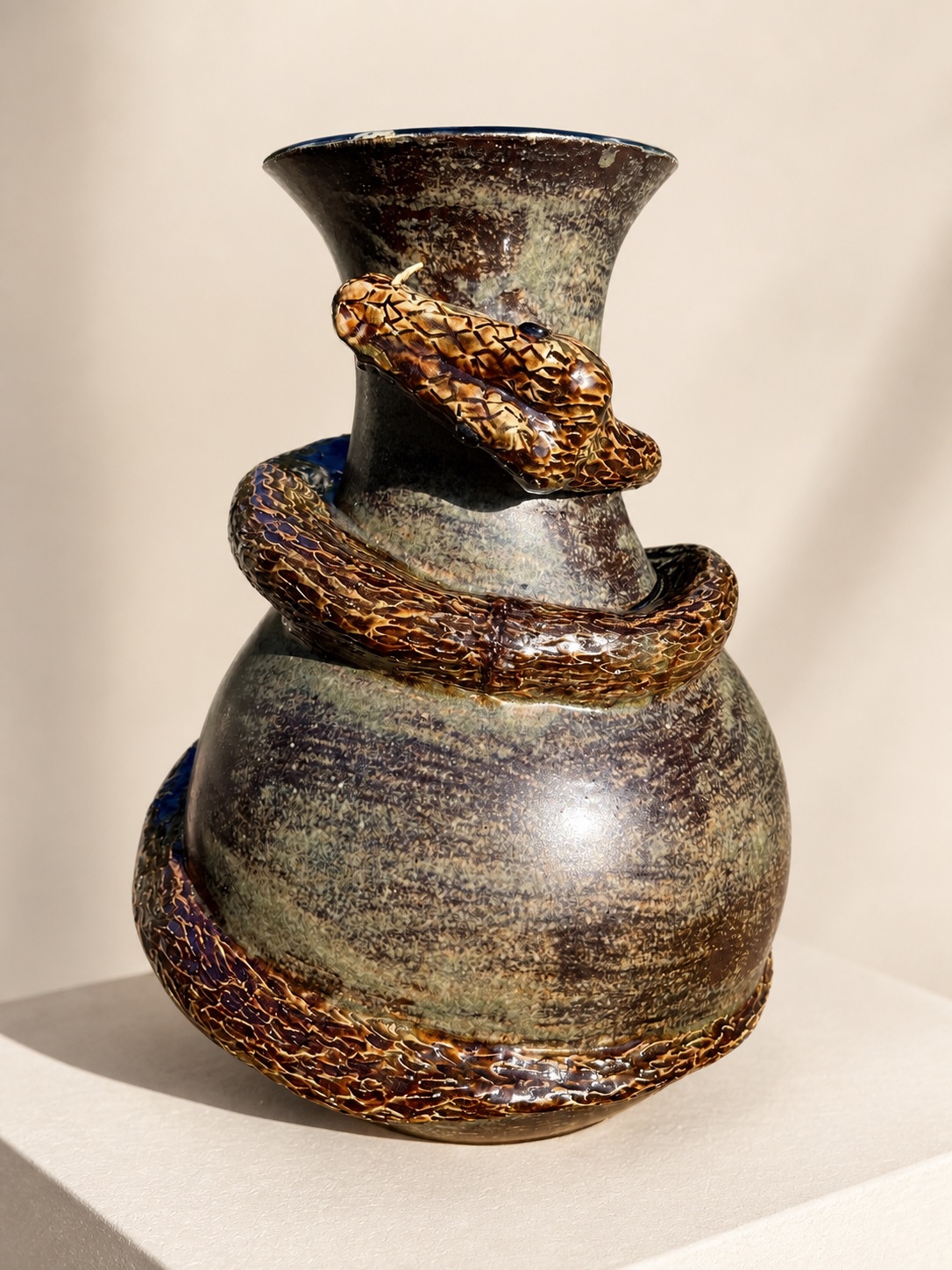 A ceramic snake vessel.