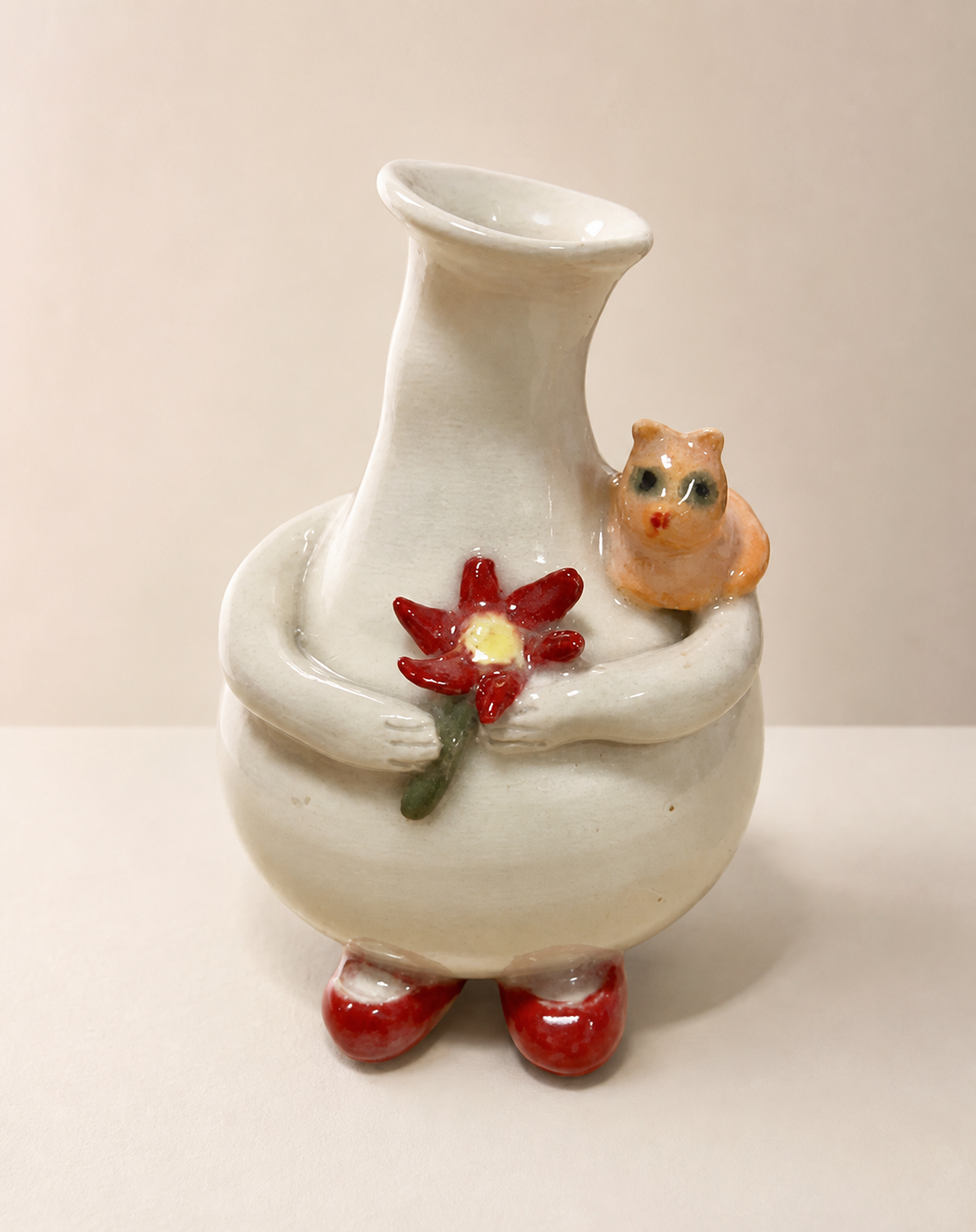An Azork with a small ceramic cat.