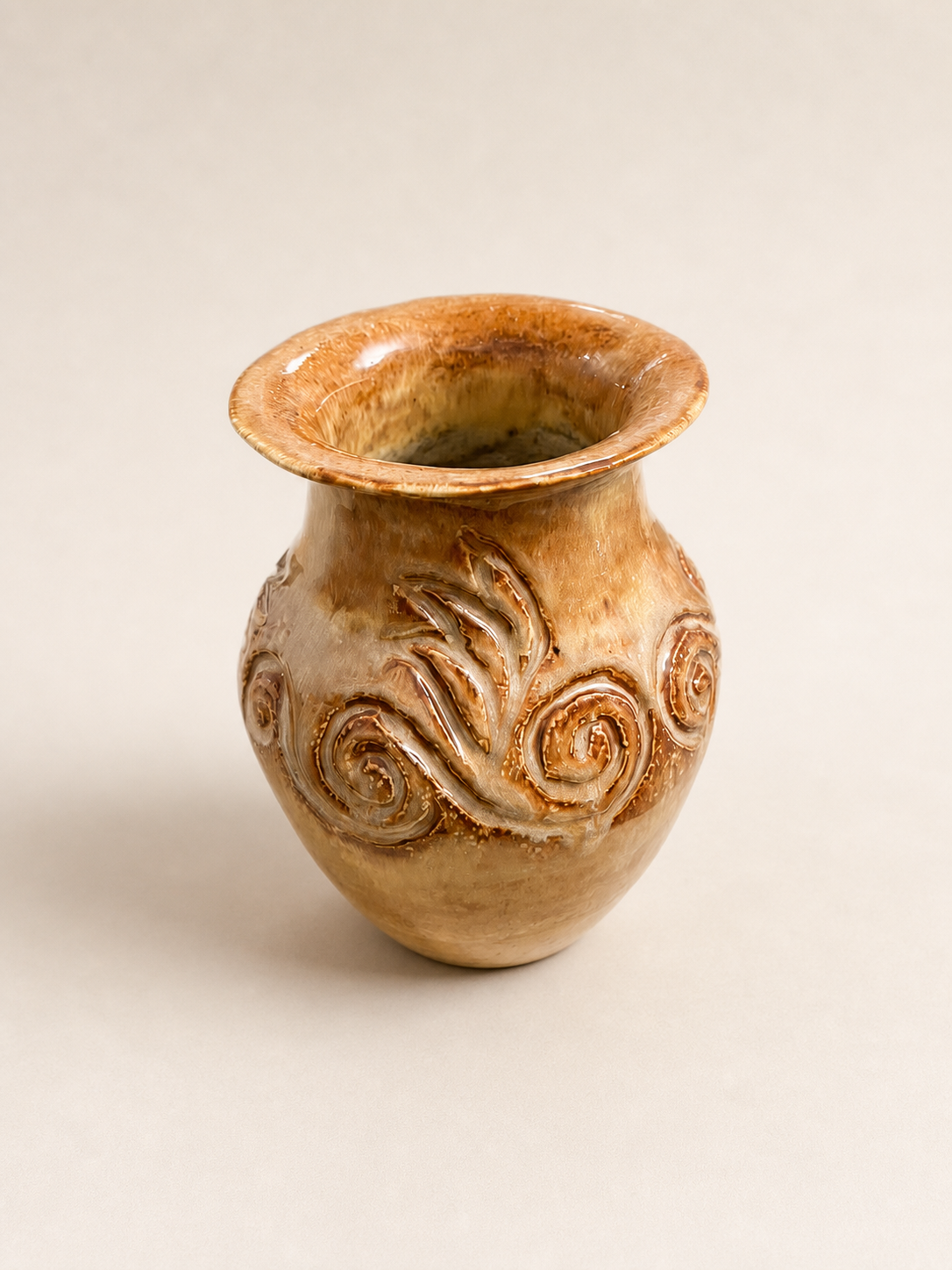 A carved vase.