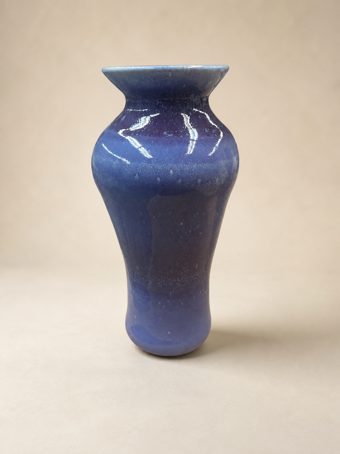 A tall blue vase.