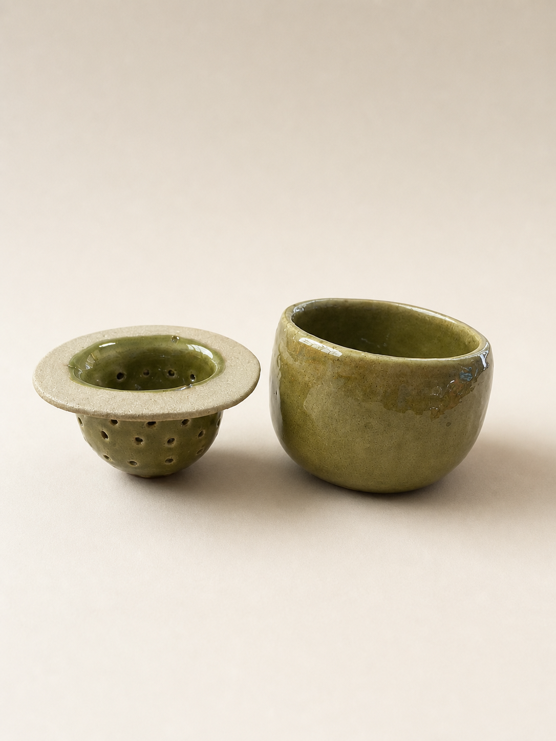 A teacup and strainer.